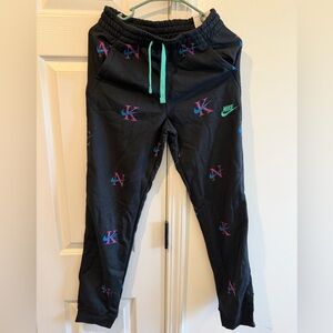 Nike Kids Black Joggers with Teal and Pink Accents